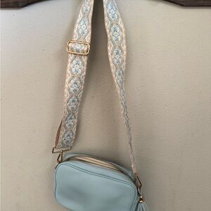 Stylish Blue Crossbody Bag with Patterned Strap